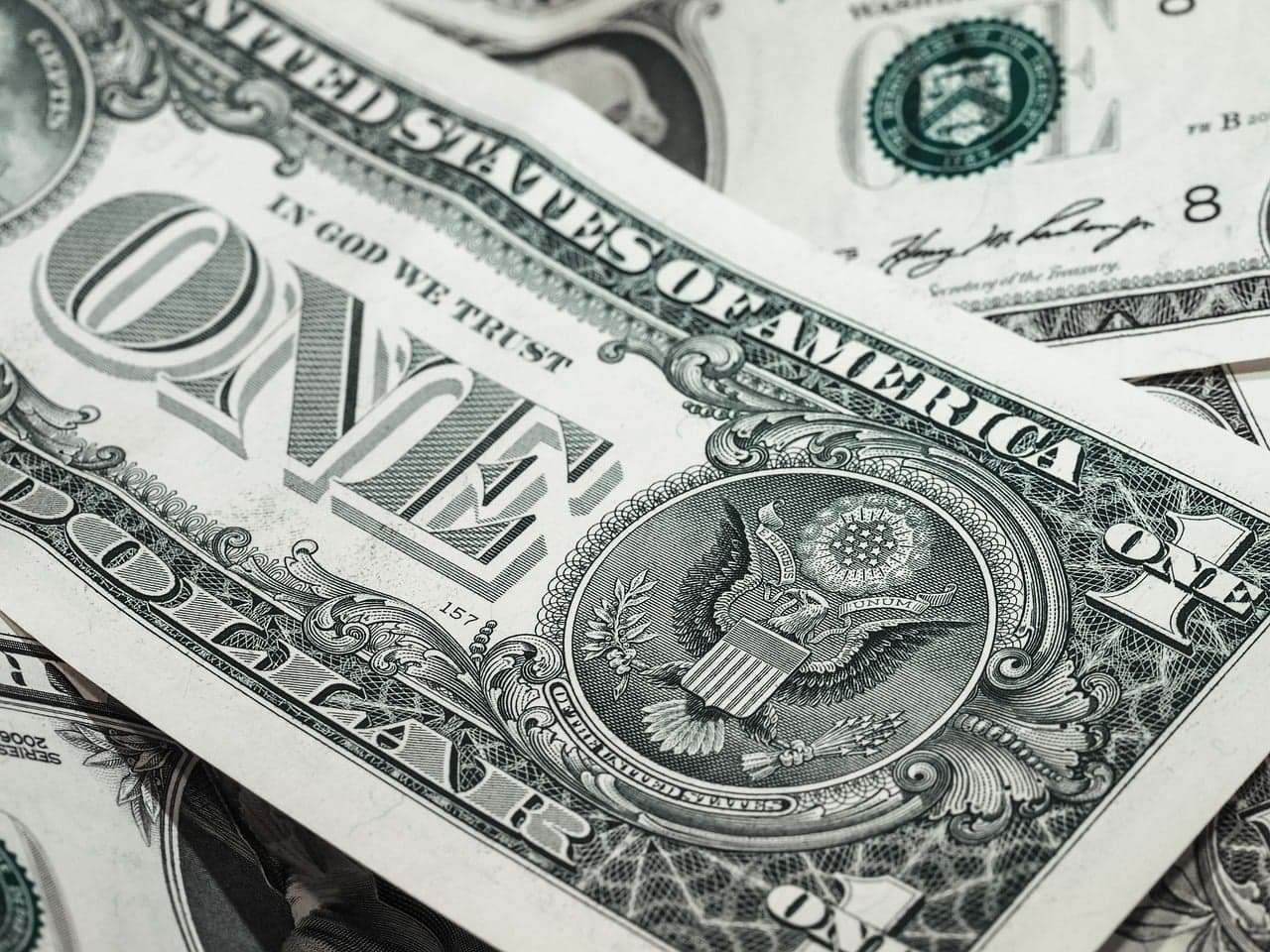 Close-up of US dollar bill with intricate seal and detailed design