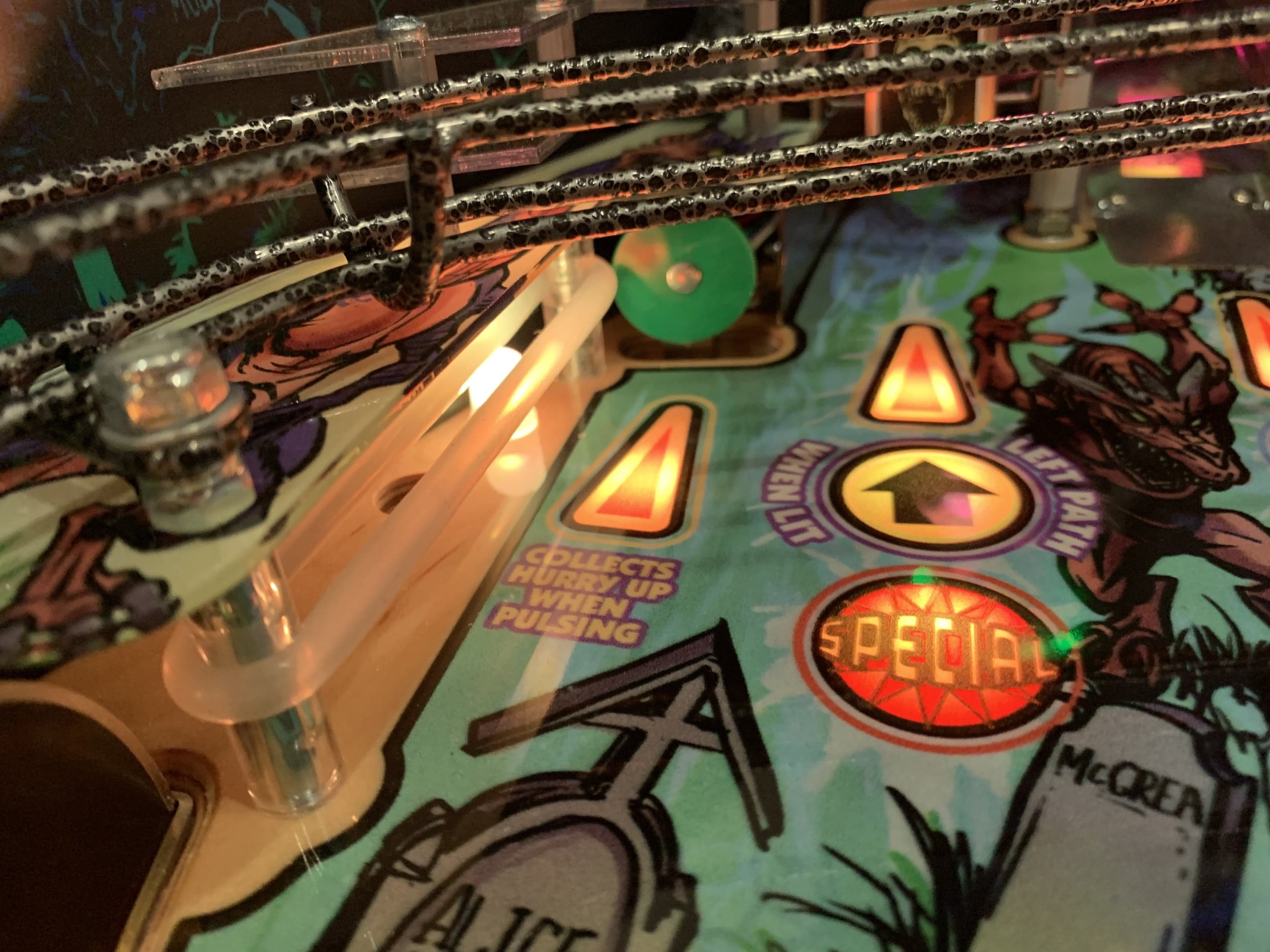Colorful pinball machine with glowing lights and special game elements