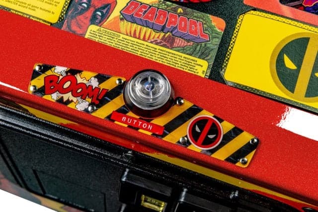 Deadpool-themed pinball machine with boom button and Deadpool logo