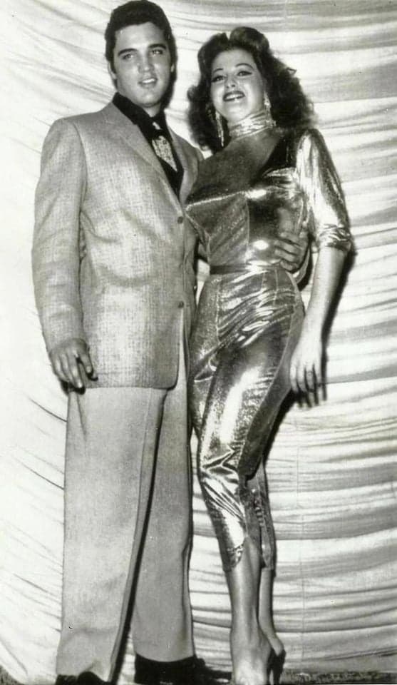 Vintage black and white photo of glamorous couple in elegant 1950s attire