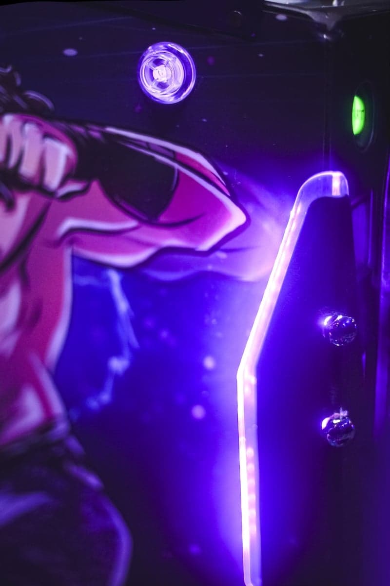 Purple and blue neon lights illuminating a sleek metallic surface