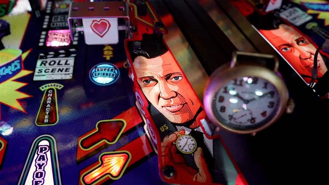 Colorful pinball machine with stylized character graphic and game elements