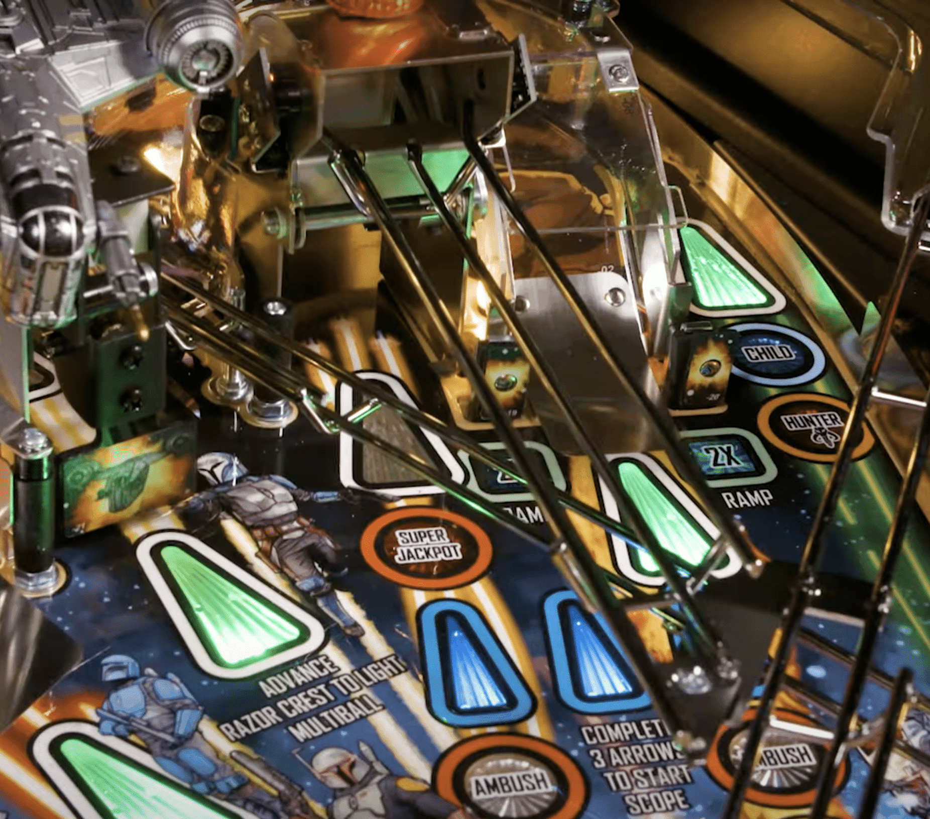 Close-up of a detailed pinball machine with colorful game elements and targets