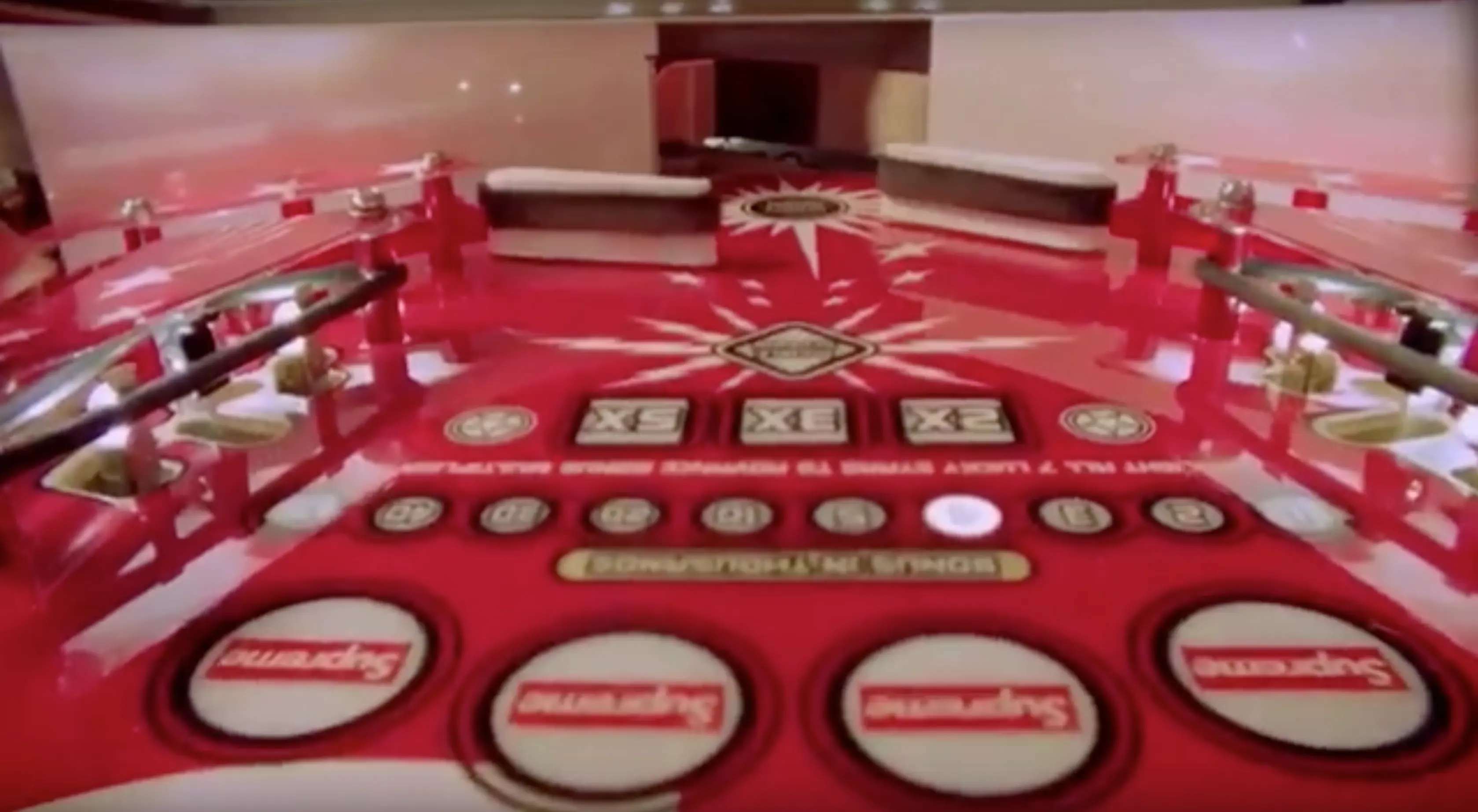 Vintage red board game with buttons and complex game layout